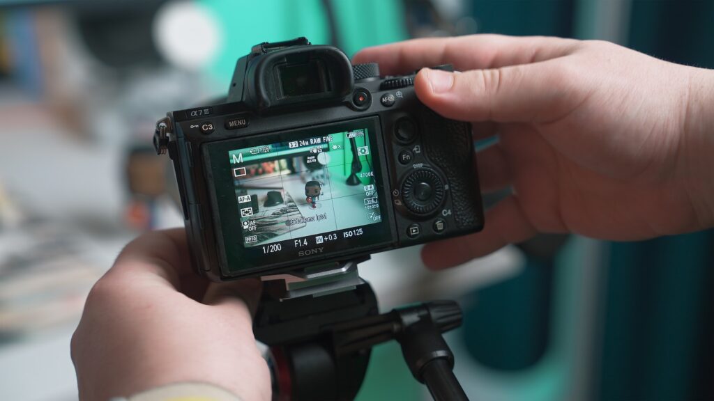 a person holding a camera up to take a picture